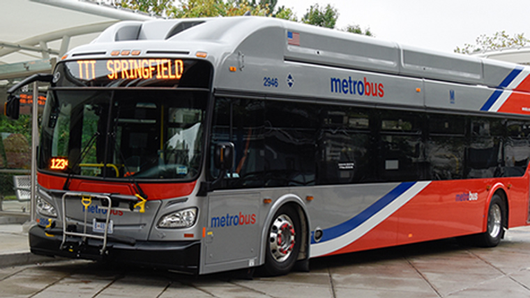 gray metro bus with blue, white, and red stripes