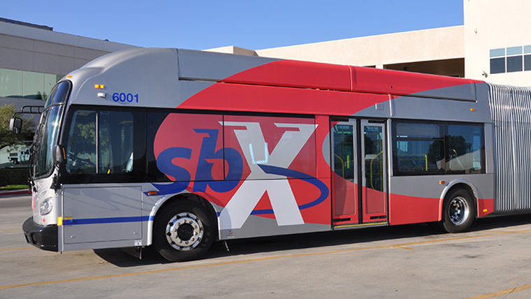 gray and red metro bus