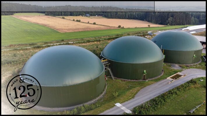 Aerial photo of three green anaerobic digesters engineered and constructed by Mead & Hunt.