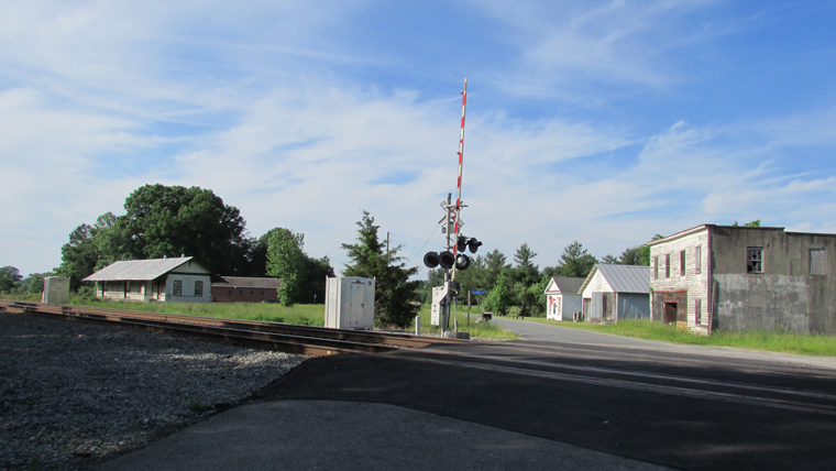 road with rail crossing running through it