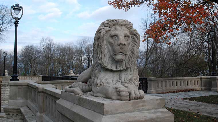 Close up of lion statue on lake park historic bridge