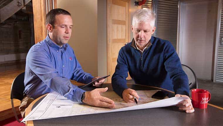 Paul Strege and Matt Dubbe look at plans for airport strategic planning
