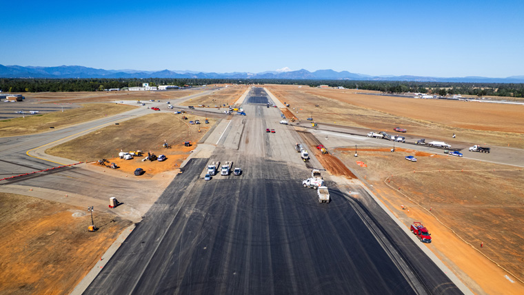 Aerial view looking down a runway under construction