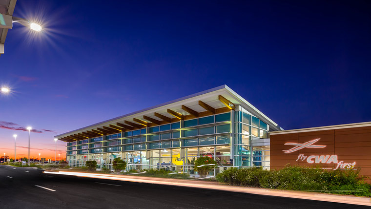 Exterior photo of Central Wisconsin Airport entrance during golden hour.