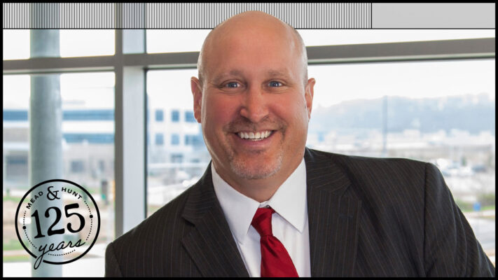 headshot of John Rathke