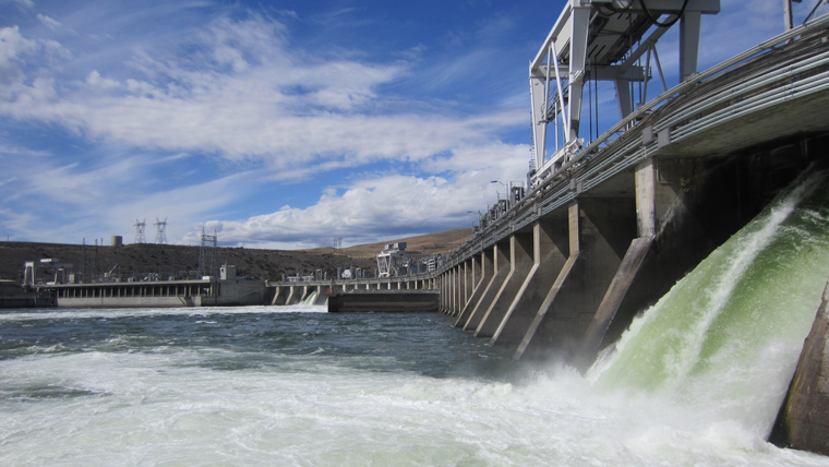 close up angle of dam with rushing water