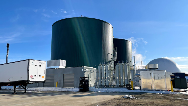 two anaerobic digesters on a sunny winter day