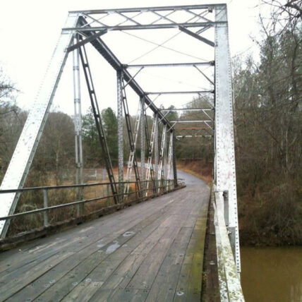 one-lane steel frame bridge with a wooden deck over the Enoree River in Enoree, SC