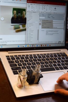 A set of artifacts on a laptop, with the computer screen in the background