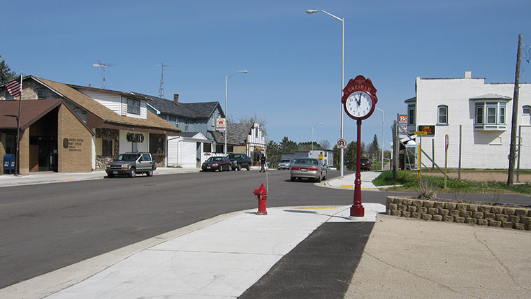 Downtown Village of Gresham with buildings and decorative clock