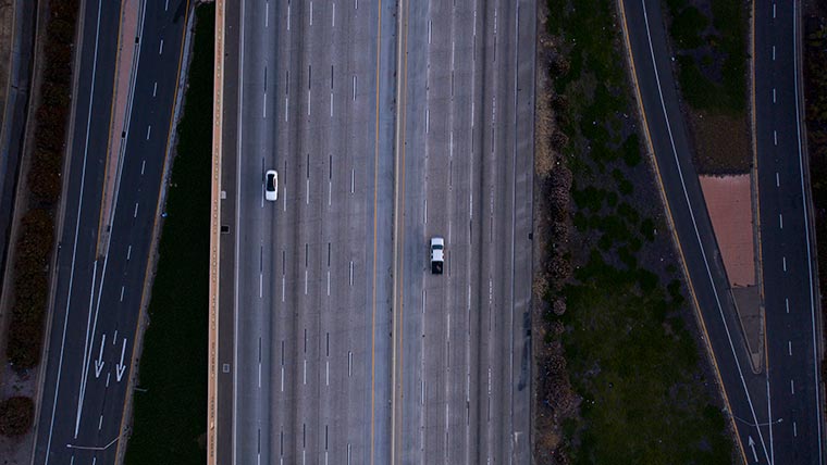 Aerial of highway with only a few cars