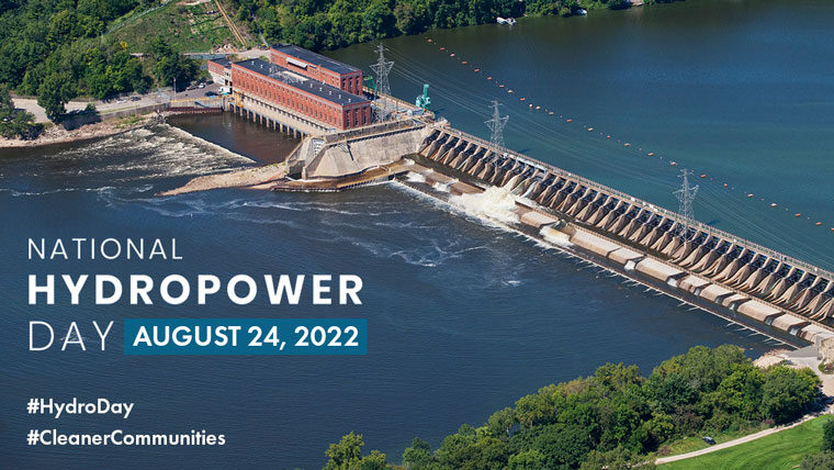 drone shot of a dam and power station and text saying National Hydropower Day, August 24, 2022, #HydroDay #CleanerCommunities