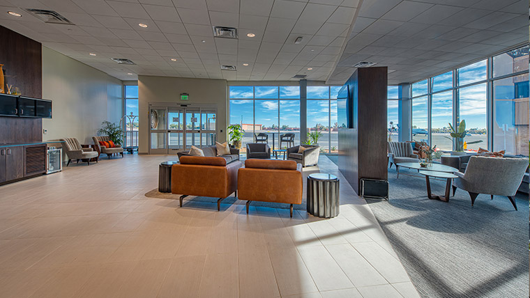 Seating area with large windows at Jet Aviation Scottsdale Airport