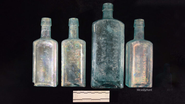 Four glass bottles next to each other