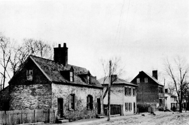 Black and white photo of a block of brick houses