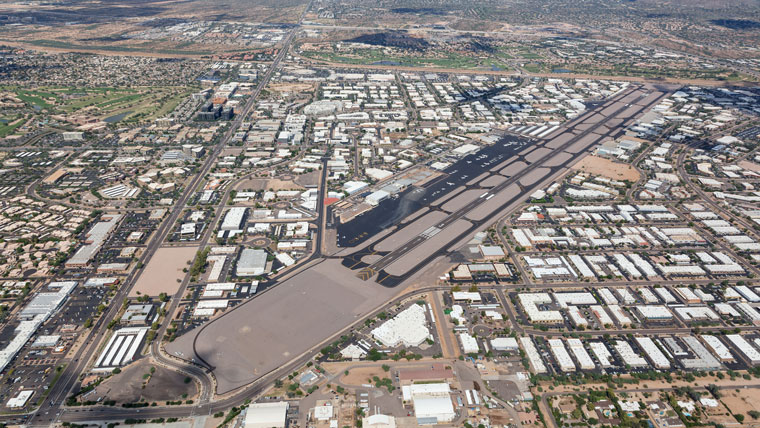 aerial view of airport runway, spanning from lower left to upper right