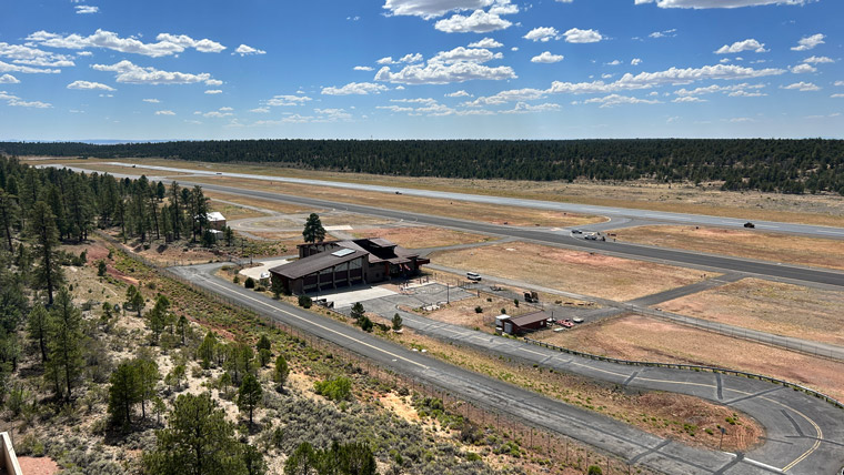 Aerial shot of Grand Canyon National Park Airport building with runway in the background