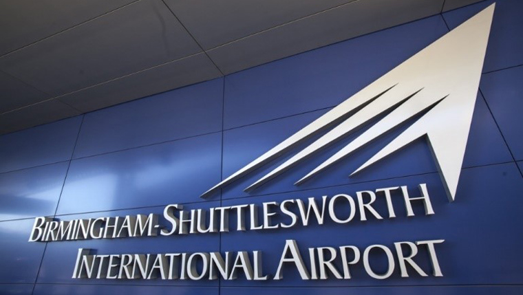 Birmingham-shuttlesworth airport name in white on blue wall