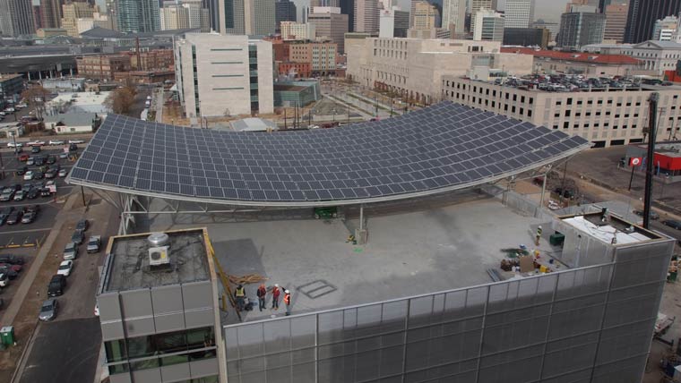 top of building with large curved solar panels