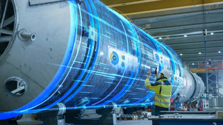 an engineer in a hard hat holds up an iPad to a large piece of equipment. Blue lines appear outlining the equipment giving the illusion that it is a digital twin of the real piece.