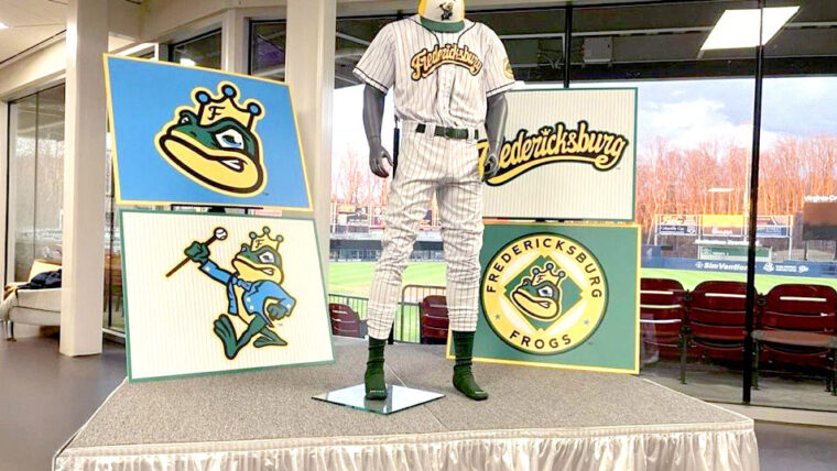 a mannequin shows a pinstriped frogs jersey with additional mascot images of a smug frog wearing a crown displayed in the background