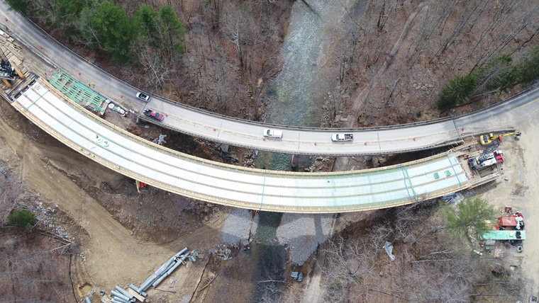aerial view of a bridge under construction over a valley