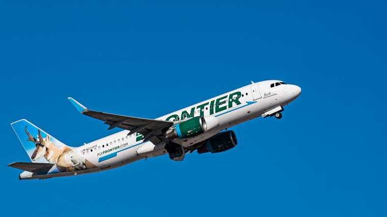 Frontier Airlines A320 N233FR airplane flying in a blue sky