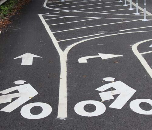 a path is painted to show a bike lane and turning bike lane
