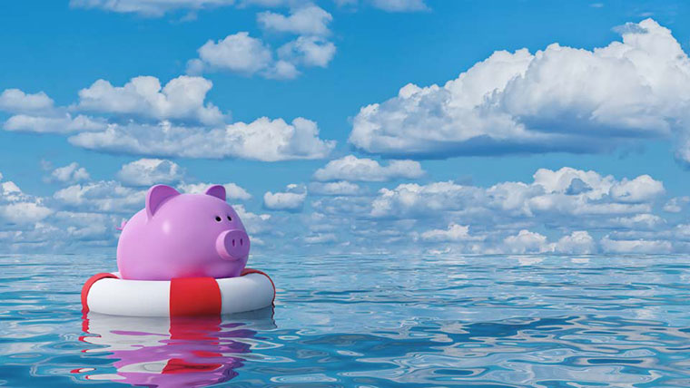Piggy bank on life raft representing funding sources