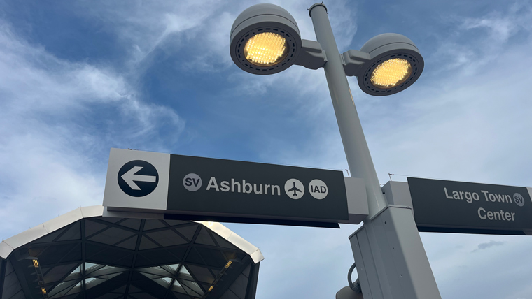 rail sign for Ashburn under streetlight
