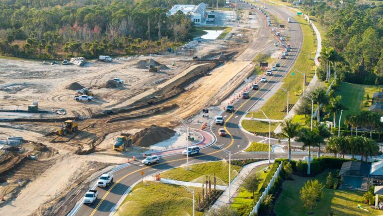aerial view of a roundabout under construction with traffic nearby