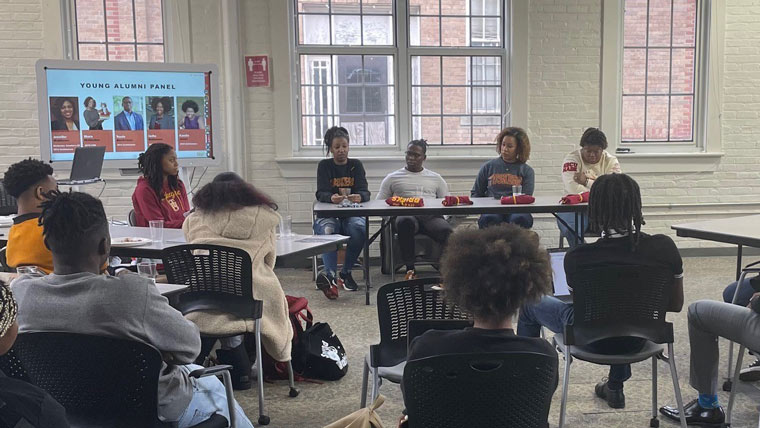 a panel of Black alumni speak to students at Tuskegee University